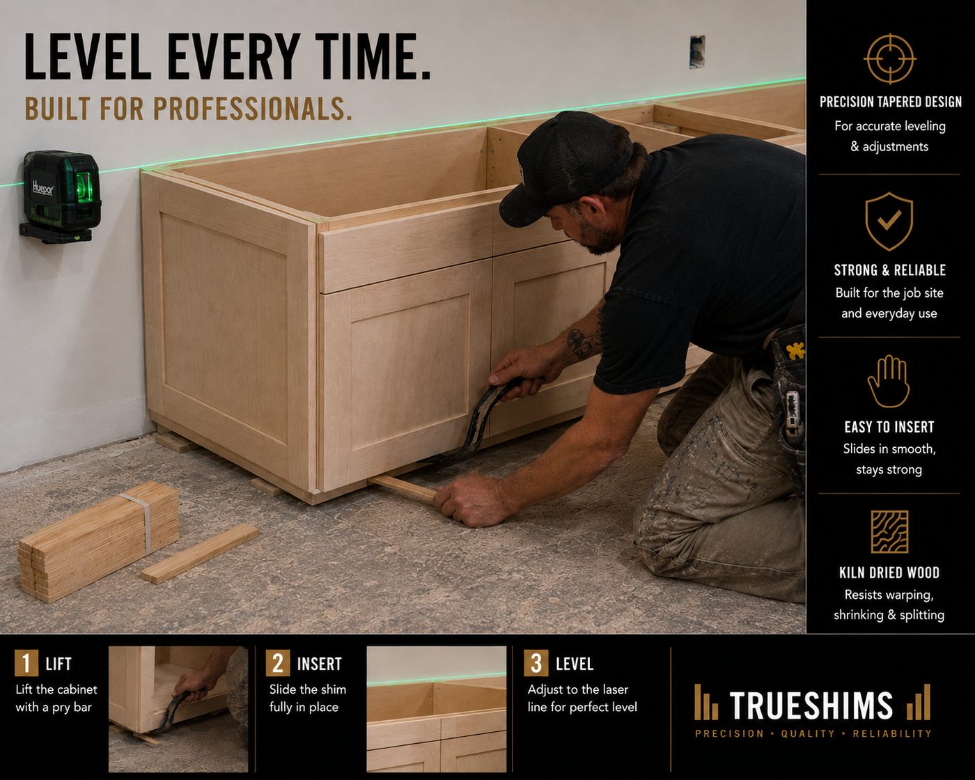 Installer shimming a base cabinet to a laser level line on a job site